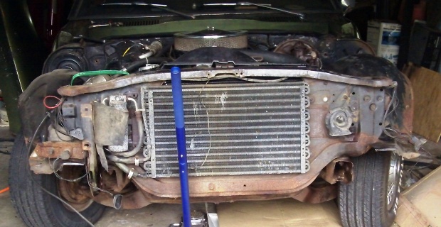 1968 Pontiact Firebird's front bumper removed to get the engine off.