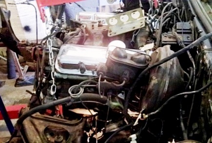 Lifting 1968 Firebird engine with manifold lift.